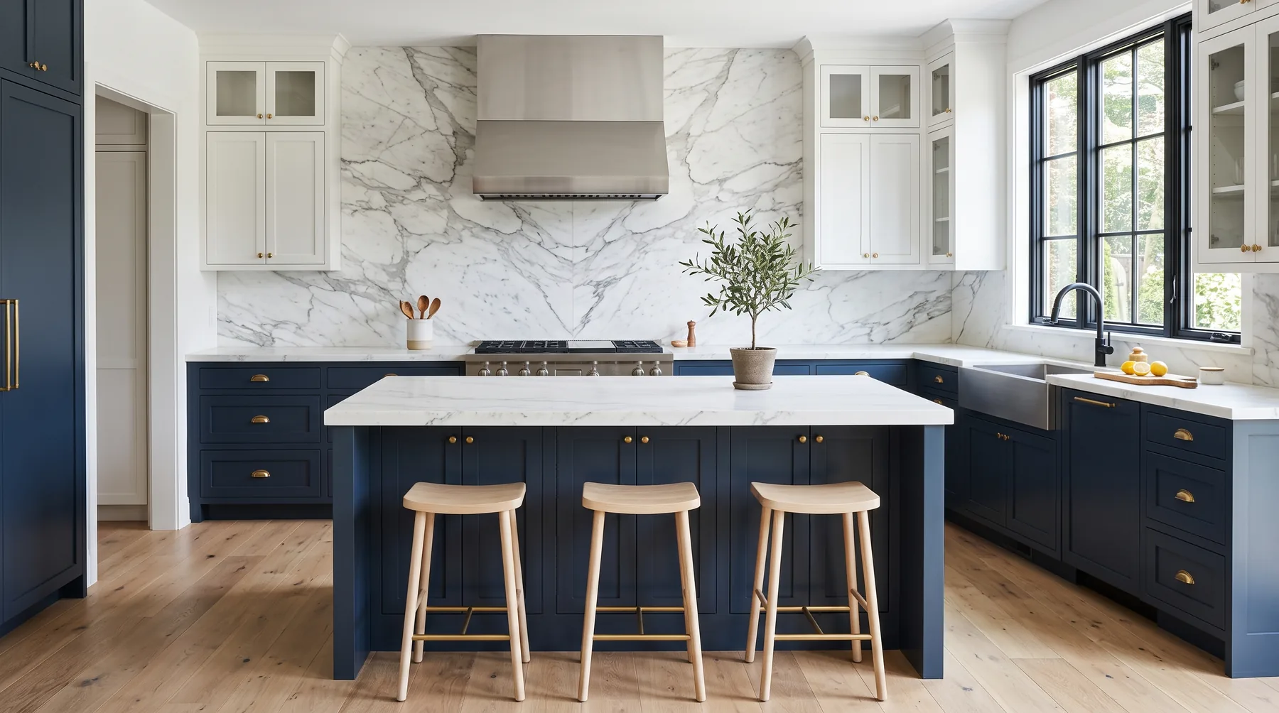 Modern kitchen with quartzite island, marble backsplash and undermount sink